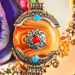 Genuine, Bright Orange-Dyed Agate Pendant With Tibetan Designs. Silver-Tone